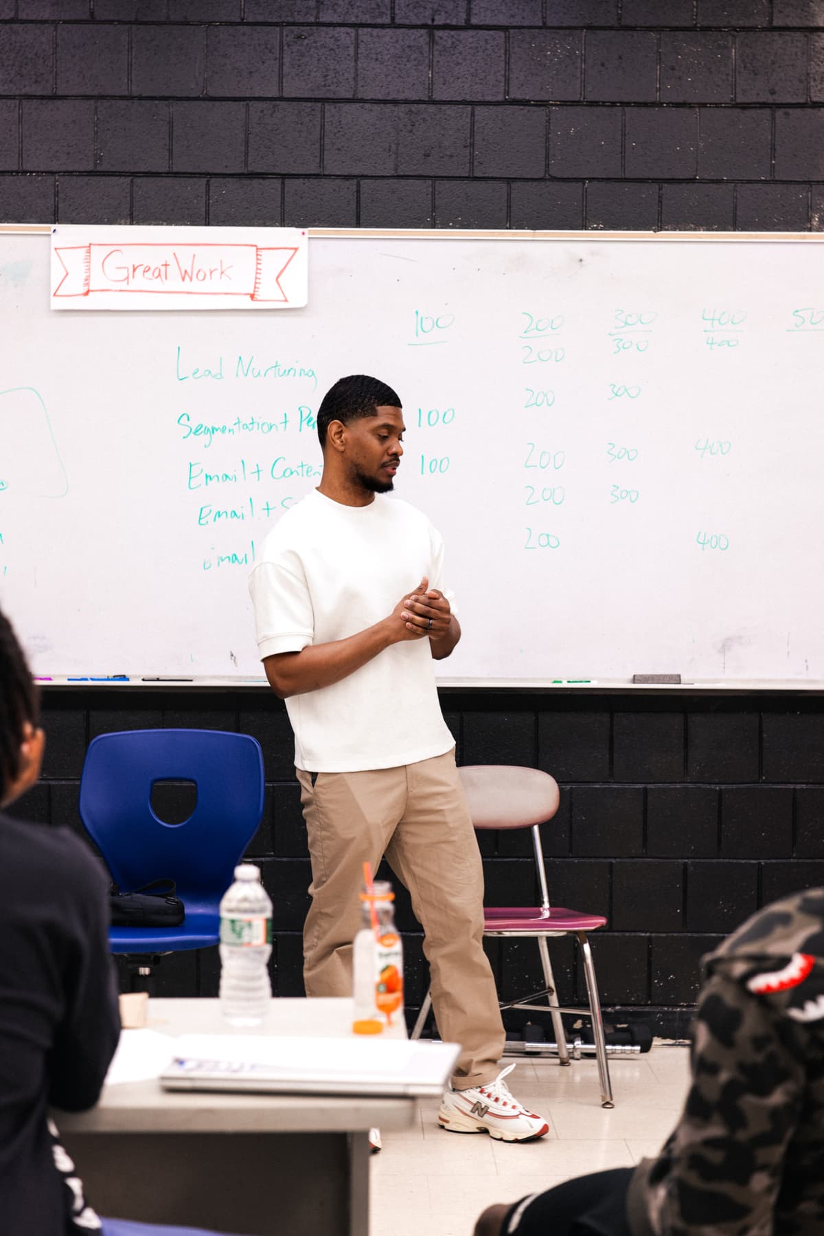 A REBELS cohort in session with students at their desks during a curriculum lecture